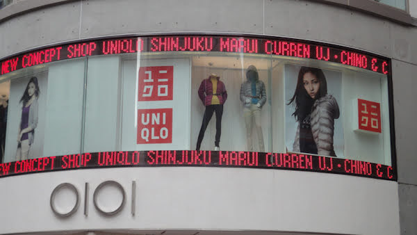 a display window with mannekins at uniqlo